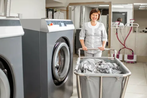 senior-washwoman-in-the-laundry-2021-12-28-02-48-03-utc